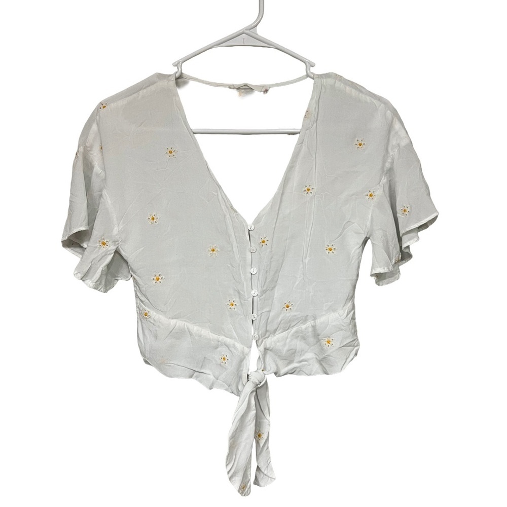 Lush White Top with Floral Accents